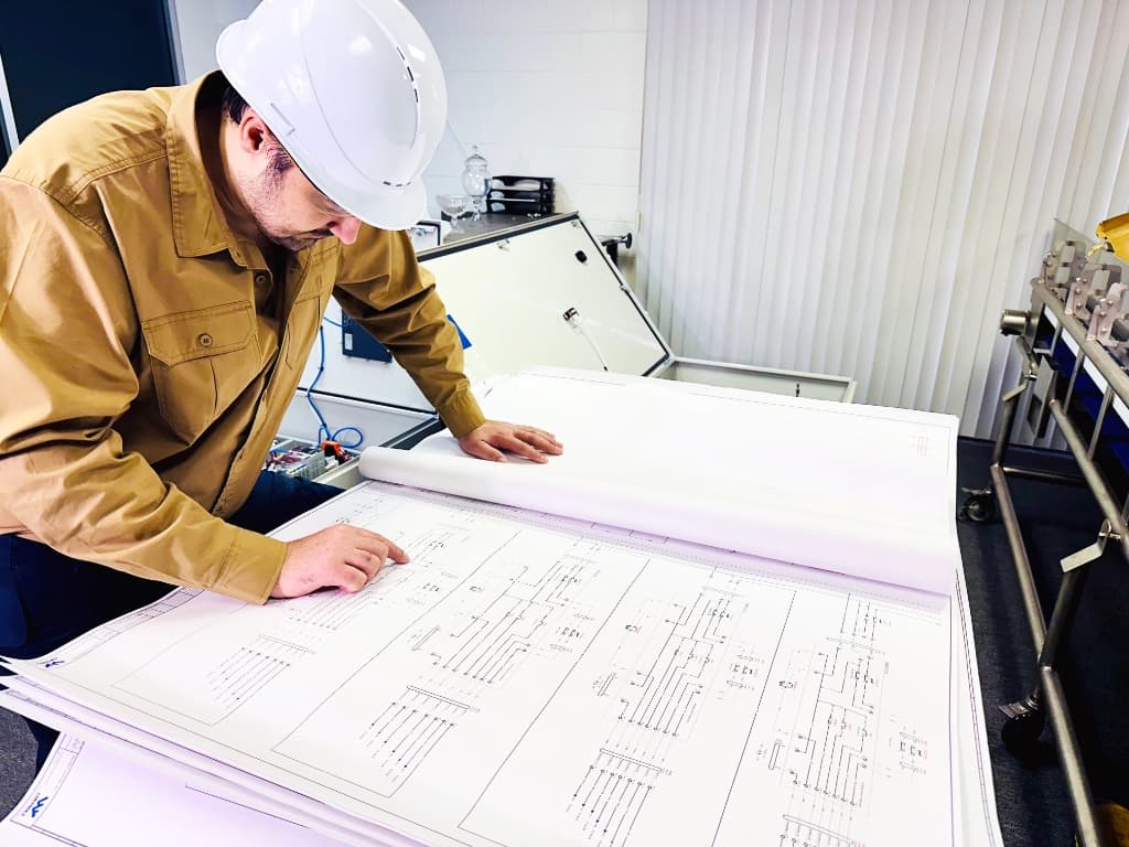 Engineer Reviewing System Blueprints